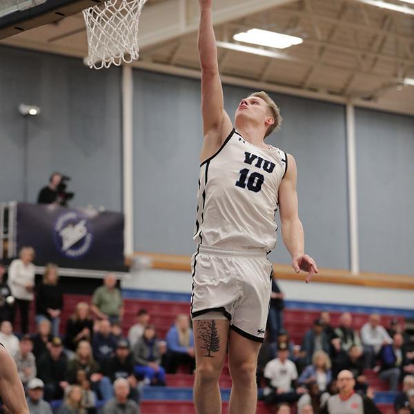 kai reaches for the hoop