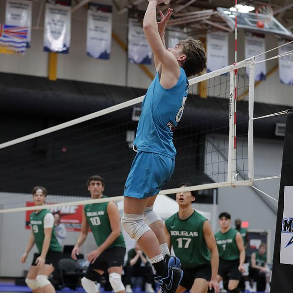 owen jumps for the volleyball