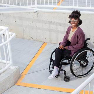 VIU student Agasha Mutesasira poses on one of the new accessibility ramps at VIUs Nanaimo campus