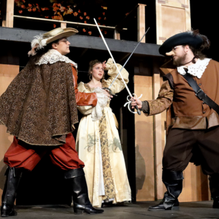 Three of the actors stage a swordfighting scene for their production Cyrano de Bergerac.