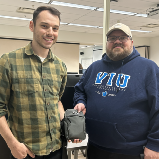 jack and jay holding their device