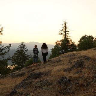 Two people stand at a viewpoint on Notch Hill