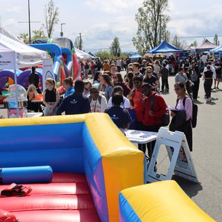 srudents outside enjoying the rock viu connect fair