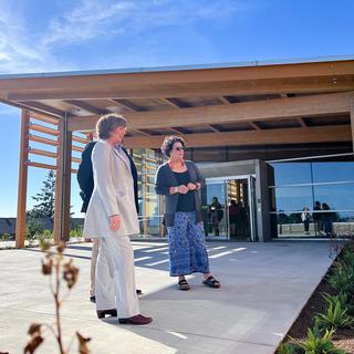 Sheila Malcolmson, MLA for Nanaimo, Richard Horbachewski and Lillian Morton tour the outside of Shq’apthut
