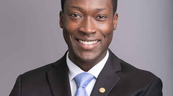 George Anderson wearing a suit with a blue tie