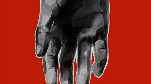 A hand pointing downward on a red background.