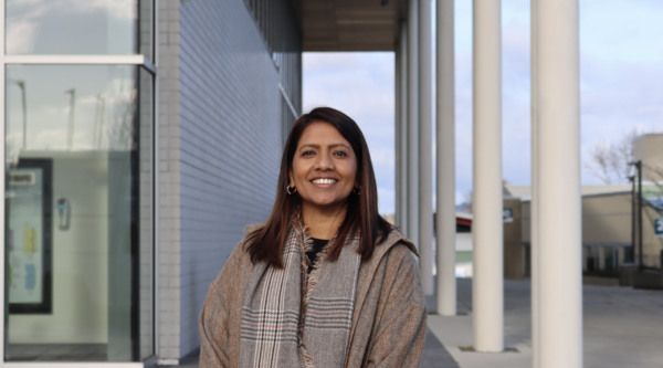 VIU Nursing professor Dr. Caroline Variath standing outside on a sunny day and smiling at the camera