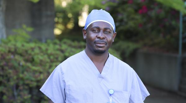 Portrait shot of Charlton Mapayi, VIU alum, in his scrubs