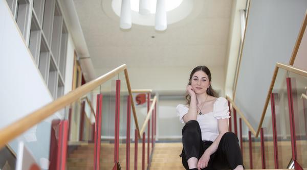 woman sitting on a set of stairs