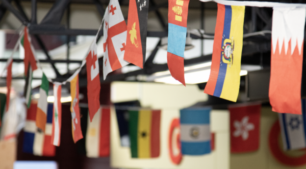 Flags from around the world strung on a banner
