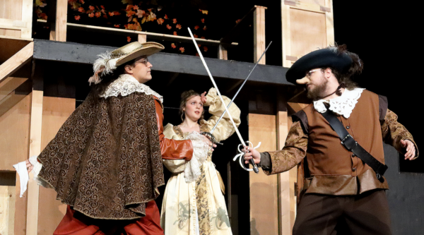 Three of the actors stage a swordfighting scene for their production Cyrano de Bergerac.