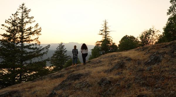 Two people stand at a viewpoint on Notch Hill