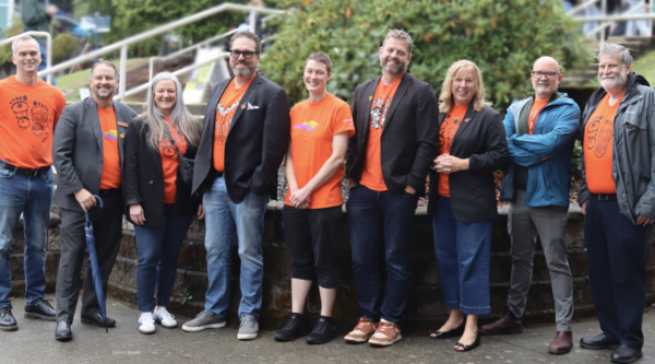 VIU Senior Leadership wearing orange shirts and smiling at the camera