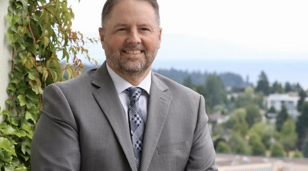 Dennis Johnson with a view of the city of Nanaimo behind him