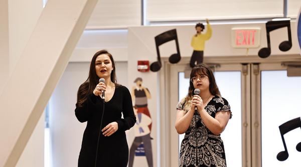 Sarah Hart and Sevilya Hendricks performing a song together at the Chinese Bridge Singing contest at UBC