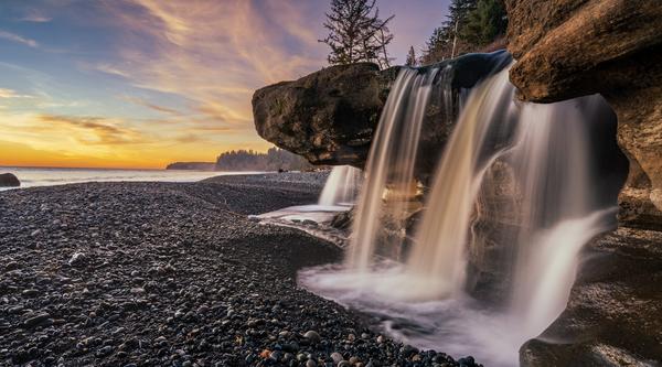 Beach scene with a waterfall