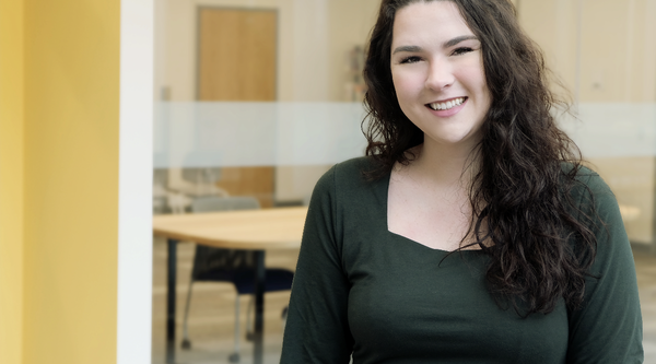 Jordyn Monaghan stands outside a classroom