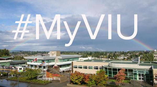 Picture of VIU's Nanaimo campus with a rainbow going across