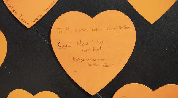 Orange heart reads "truth comes before reconciliation" and "Ganu tlalire lax" (don't forget) and kaeda gangananam (for the children)