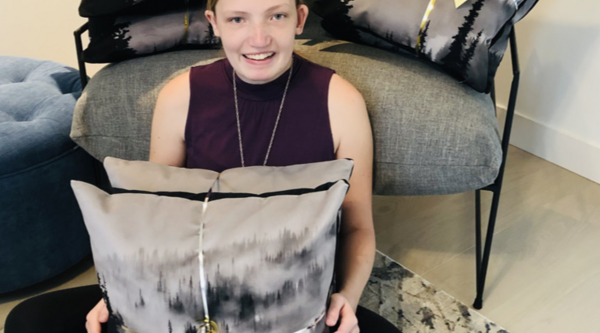 Picture of Kendyl Perry holding pillows