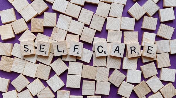 self-care written in scrabble blocks