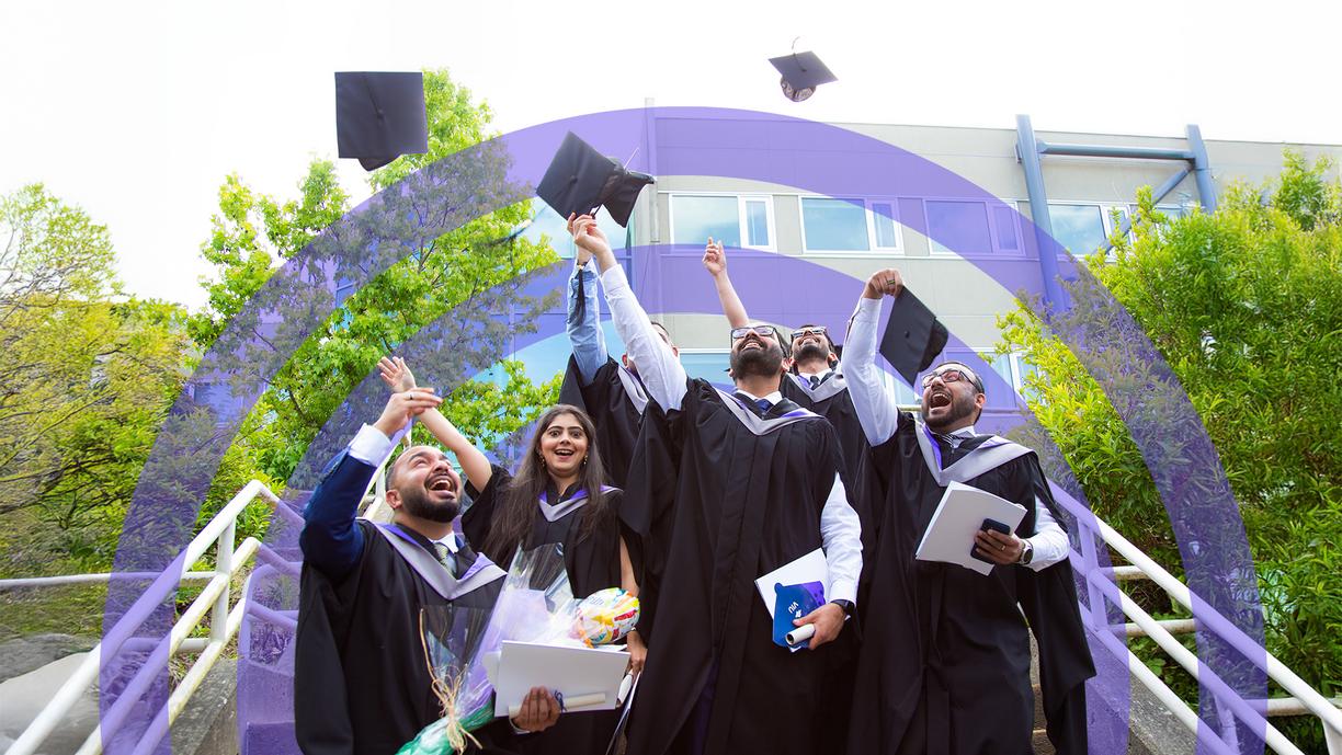 Grads throw their caps in the air