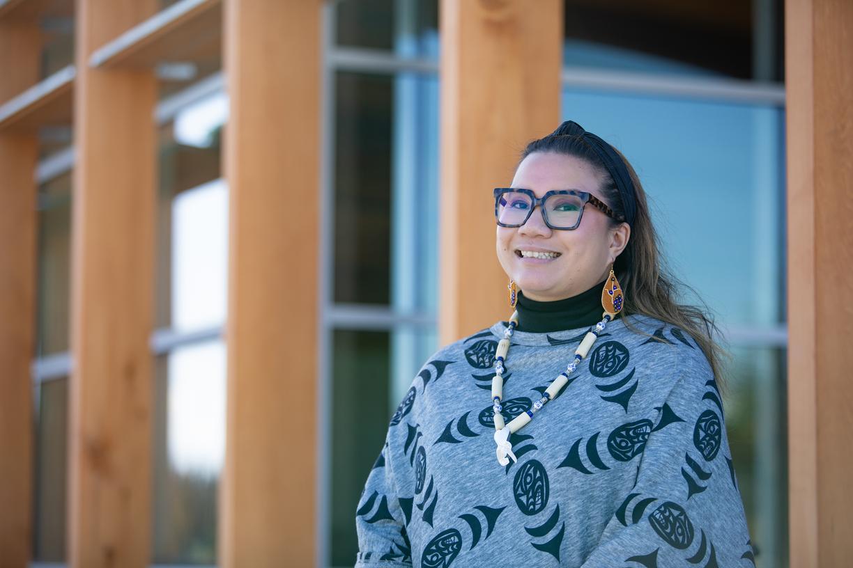 Leah stands in front of gathering place