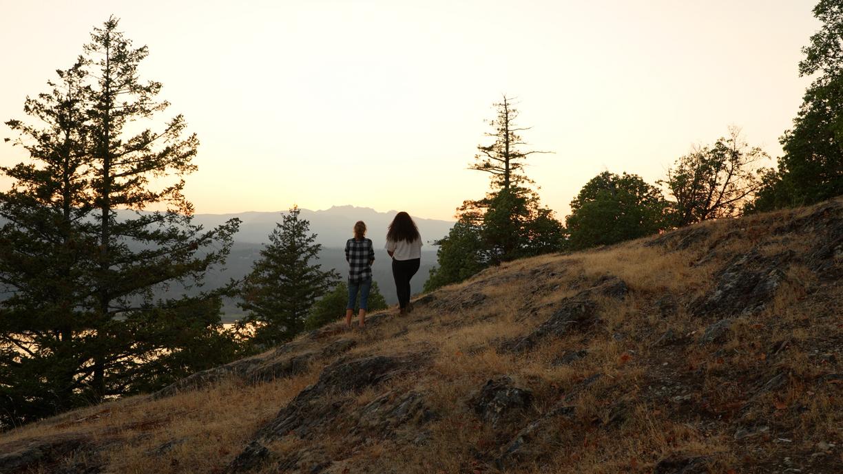 Two people stand at a viewpoint on Notch Hill