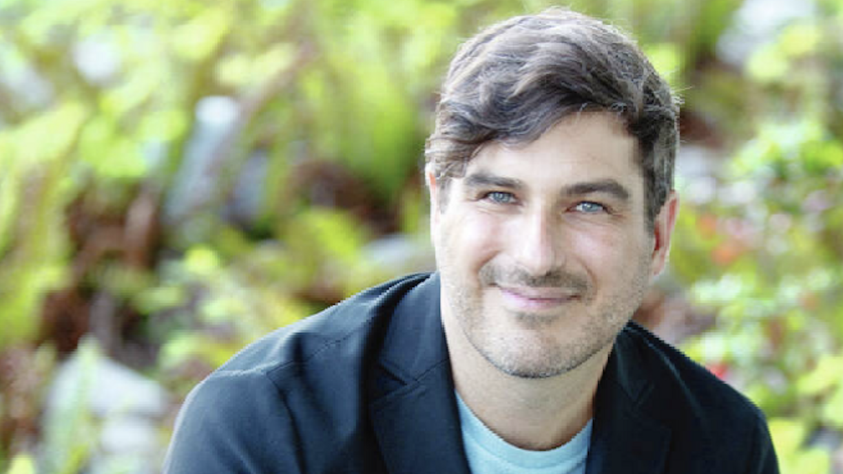 Michael MacKenzie smiling at the camera.