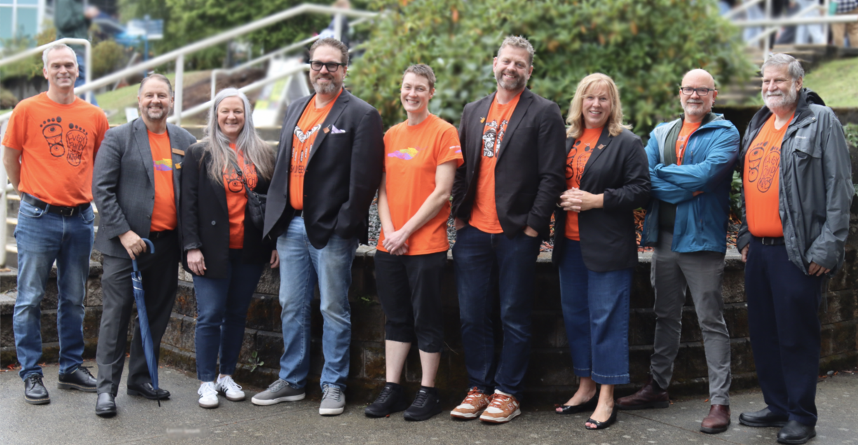 VIU Senior Leadership wearing orange shirts and smiling at the camera