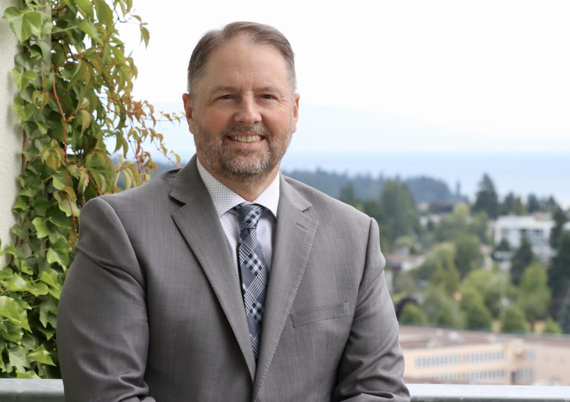 Dennis Johnson with a view of the city of Nanaimo behind him