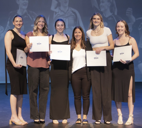 Danielle Hyde at an awards event with VIU Mariners women's volleyball team members