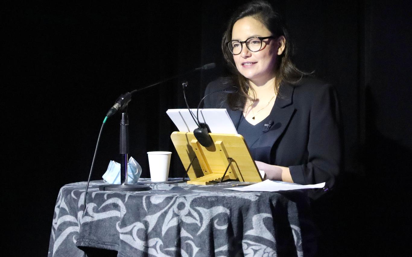 Indigenous Speakers Series keynote Connie Walker speaks at a podium in the Malaspina Theatre