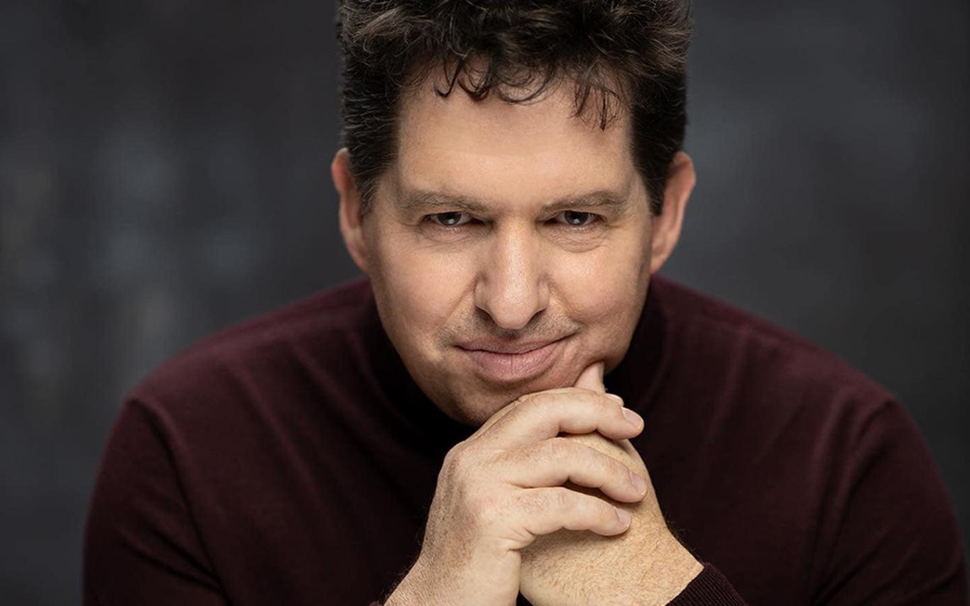 Leon Potter clasps his hands at his chin.