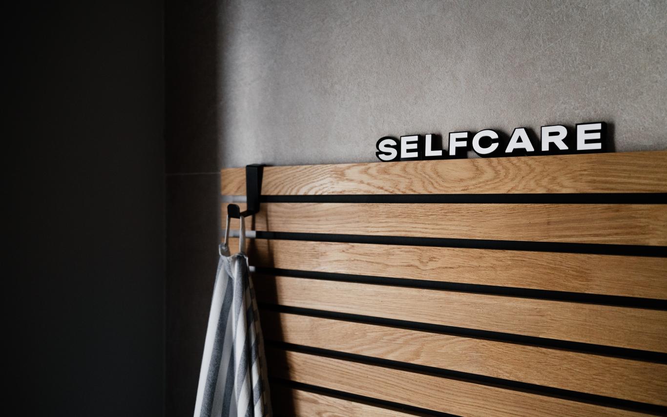 Board with self care written on the top