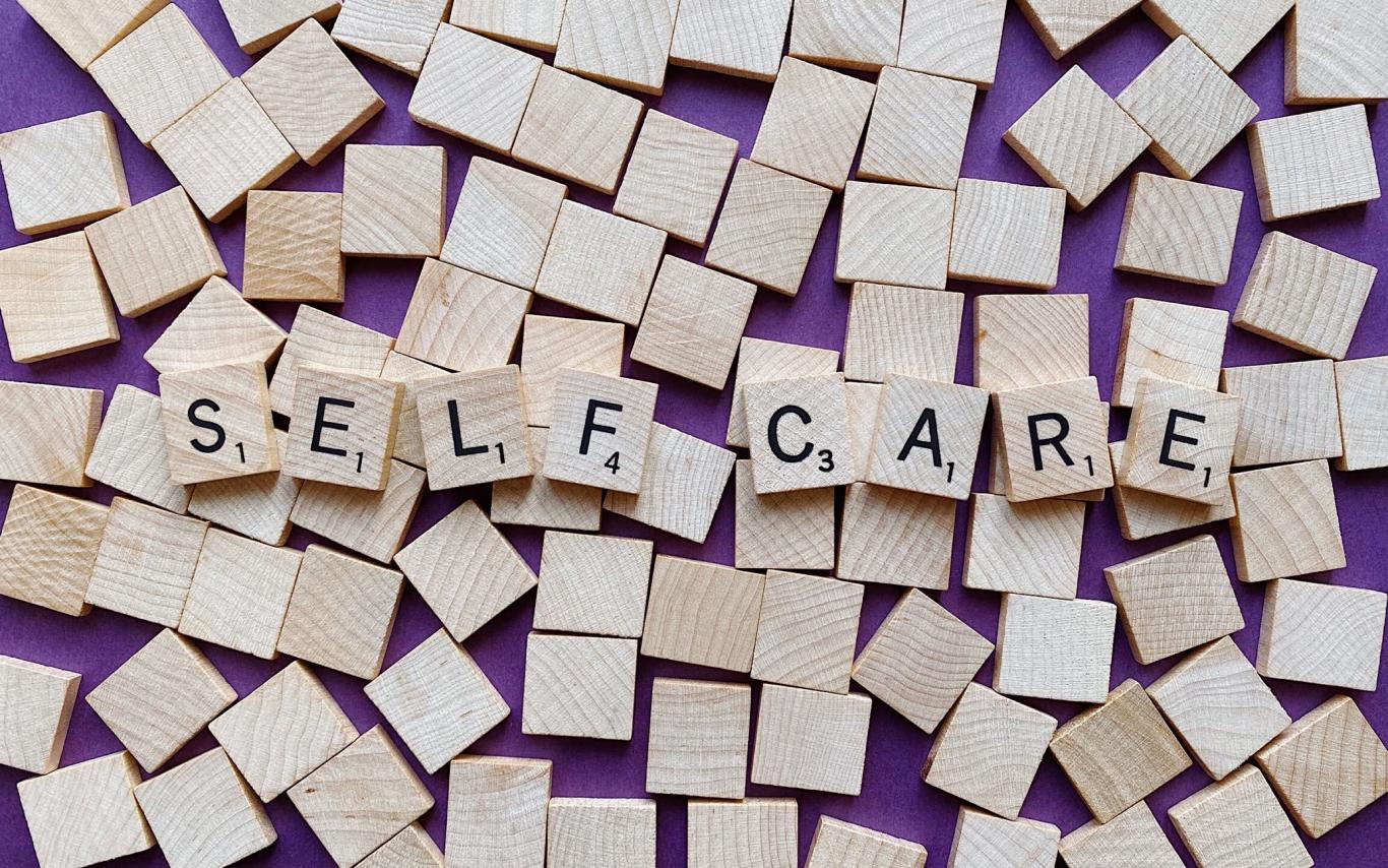 self-care written in scrabble blocks