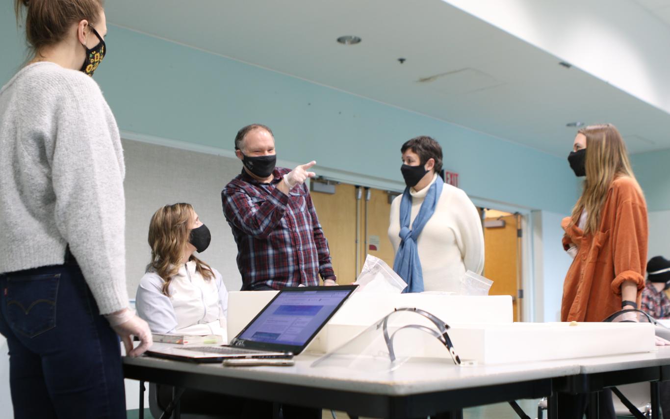 VIU students and instructor wearing masks and talking